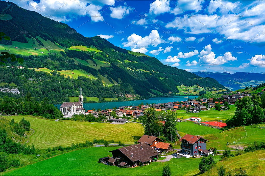 Lungern Village in the Swiss Alps with Lake and Church HD wallpaper