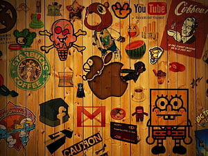 Wooden Wall Collage of Pop Culture Logos and Cartoon Characters HD wallpaper