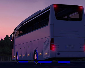 White Coach Bus with Blue Underglow Lighting on a Highway at Dusk HD wallpaper