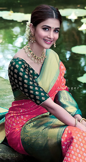 Pooja Hegde in Green and Gold Silk Saree with Traditional Jewelry by a Lotus Pond HD phone wallpaper