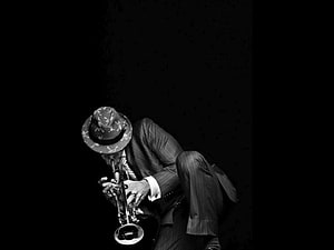 Black and White Portrait of a Jazz Trumpet Player in a Pinstripe Suit and Fedora HD wallpaper