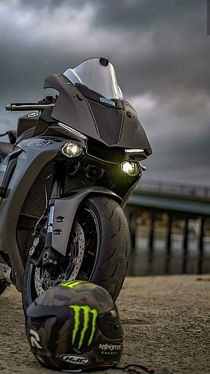 Yamaha R1 Superbike with Monster Energy Helmet Under Stormy Sky HD phone wallpaper