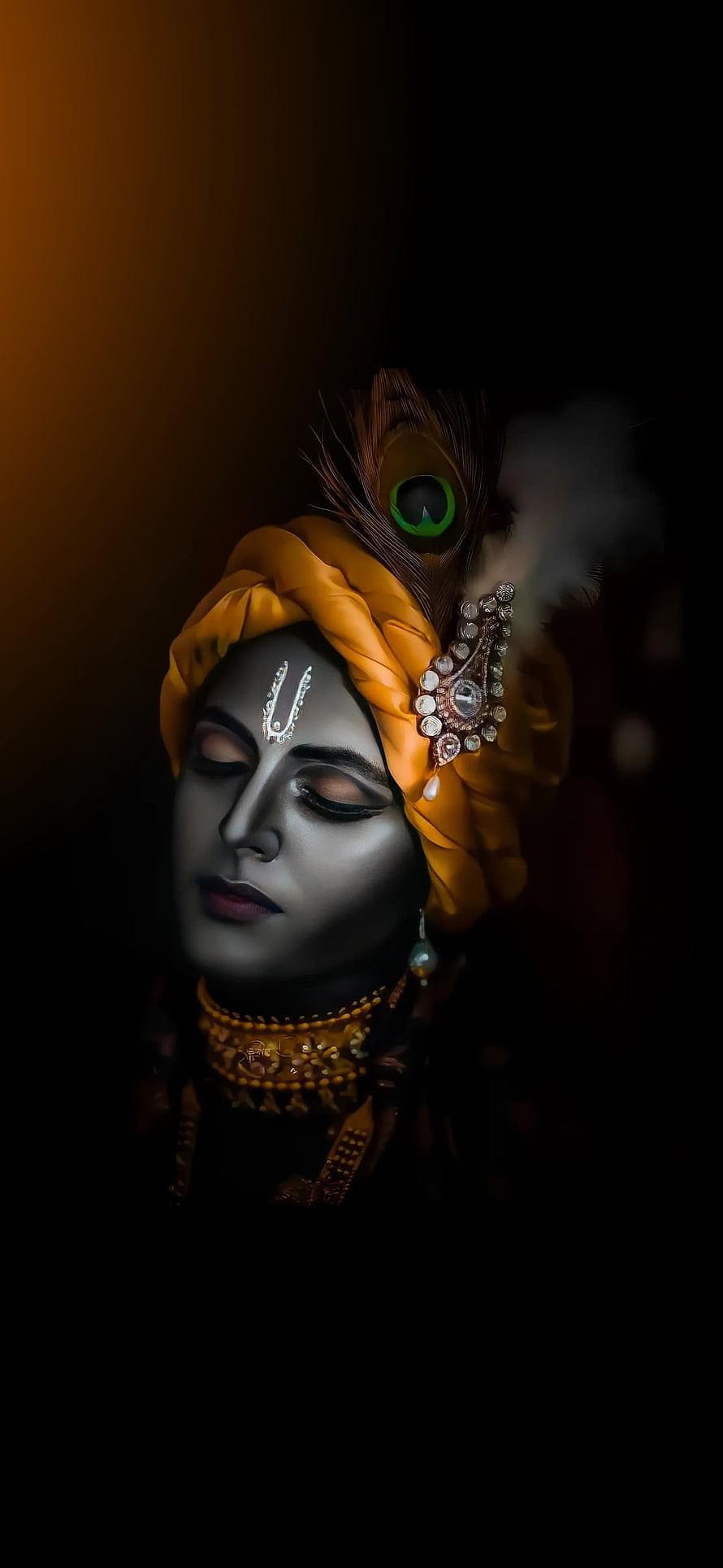 Portrait of a woman in traditional Indian attire with a yellow turban and peacock feather HD phone wallpaper