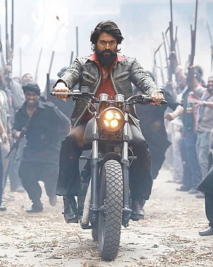 KGF Rocky Biker Scene With Armed Crowd And Dusty Road HD phone wallpaper
