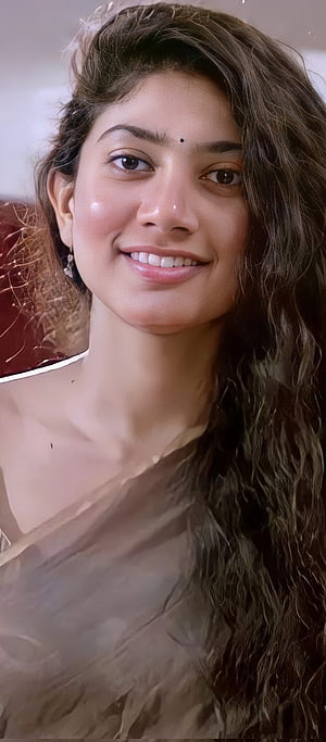 Sai Pallavi Portrait With Long Wavy Hair And Warm Smile HD phone wallpaper