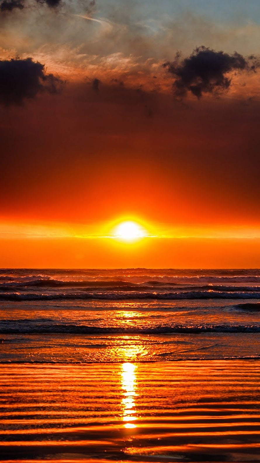 Vibrant Orange Ocean Sunset with Dramatic Clouds and Golden Water Reflection HD phone wallpaper