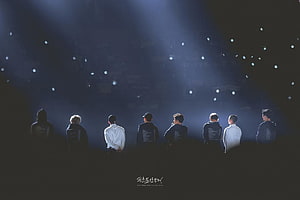 EXO Members Silhouetted on Stage Under Dramatic Blue Spotlight Beams HD wallpaper