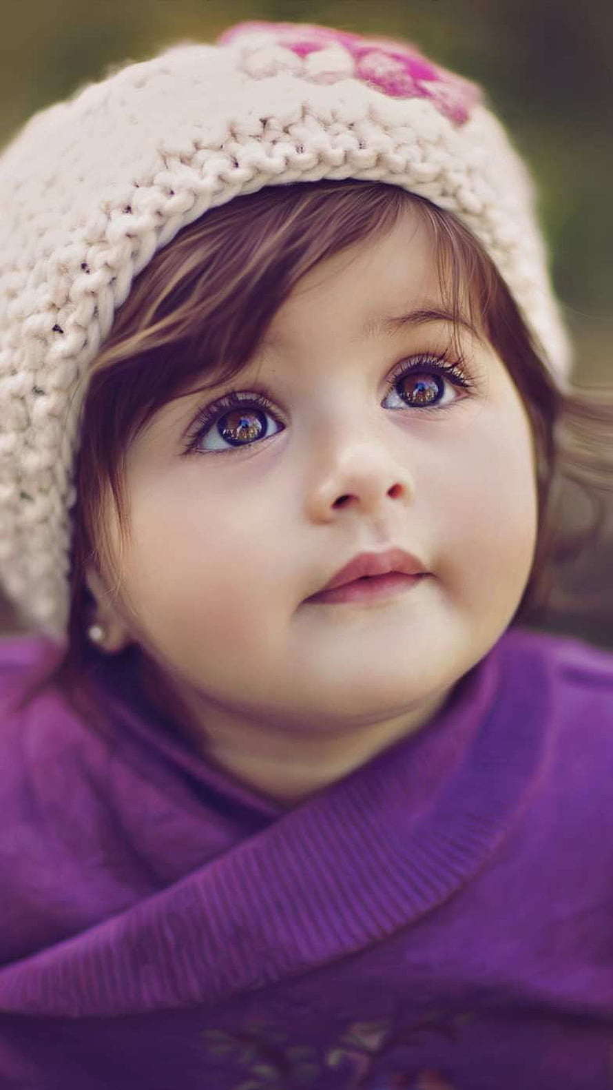 Adorable Baby Girl Wearing a Knit Beanie and Purple Sweater HD phone wallpaper