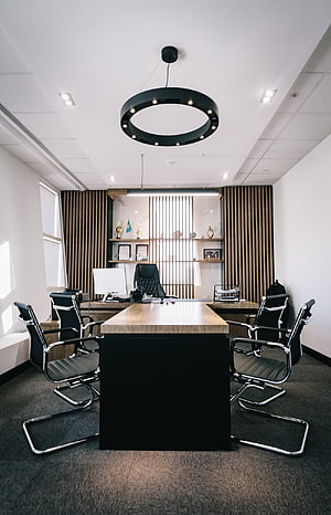 Modern Executive Office Interior With Black Ring Chandelier And Wood Slat Wall Paneling HD phone wallpaper