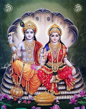 Lord Vishnu and Goddess Lakshmi Seated on Serpent Throne with Om Symbols HD phone wallpaper