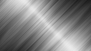 Diagonal Brushed Steel Surface with Soft Light Reflections and Industrial Texture HD wallpaper