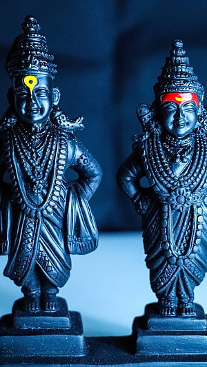 Black Stone Statues of Lord Vitthal and Goddess Rukmini with Traditional Ornamentation HD phone wallpaper