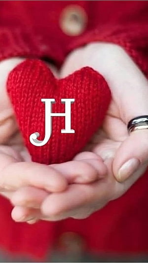 Hands Holding a Red Knitted Heart with White JH Monogram on a Red Sweater HD phone wallpaper