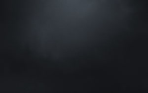 Dark Charcoal Surface Texture with Subtle Gradient and Minimalist Matte Finish HD wallpaper