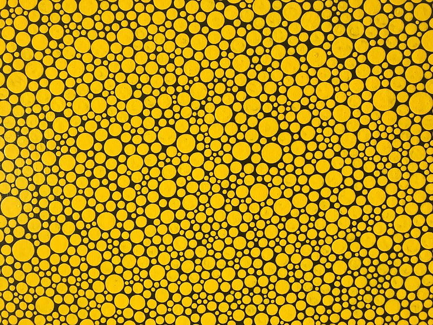 Yayoi Kusama Polka Dot Pattern with Yellow Circles on Black Background HD wallpaper
