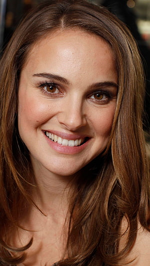Natalie Portman Close-Up Portrait with Warm Smile and Brown Hair HD phone wallpaper