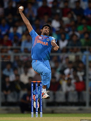 Jasprit Bumrah Delivering a Bowling Action in India Cricket Jersey HD phone wallpaper