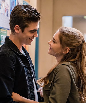Tessa Young and Hardin Scott sharing a tender moment in a school hallway HD phone wallpaper