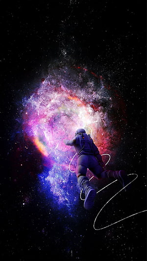 Astronaut Floating in Deep Space Before a Vibrant Purple and Pink Nebula HD phone wallpaper