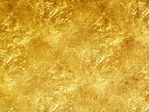 Shimmering Gold Foil Texture with Organic Metallic Surface and Warm Amber Tones HD wallpaper