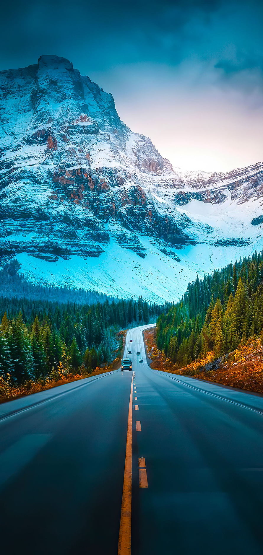 Winding Mountain Highway Through Snow-Capped Peaks and Evergreen Forest HD phone wallpaper