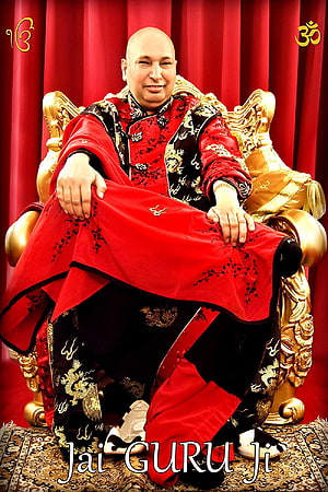 Jai Guru Ji Portrait of a Spiritual Leader in Red and Gold Attire Seated on an Ornate Throne HD phone wallpaper