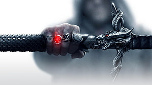 Hand Gripping Ornate Dragon Sword with Glowing Red Gem and Silver Rings HD wallpaper
