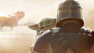 The Mandalorian and Grogu in a Dusty Desert Scene with a Speeder Bike in the Background HD wallpaper