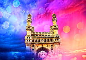Charminar Monument in Hyderabad Under a Vibrant Pink and Blue Sky with Bokeh Light Effects HD wallpaper