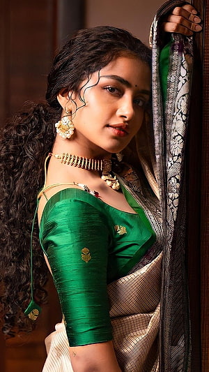 Anupama Parmeshwaran in a Green Silk Saree with Traditional Gold Jewelry HD phone wallpaper