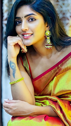 Eesha Rebba in a Golden Silk Saree with Traditional Jhumka Earrings and Bindi HD phone wallpaper