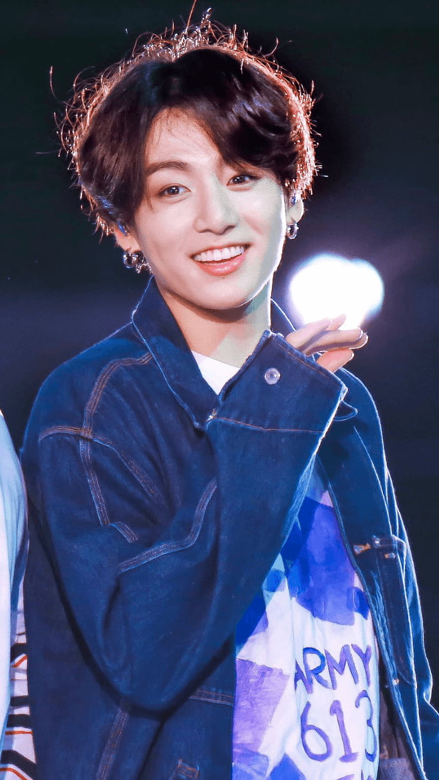 Jungkook from BTS smiling on stage in a denim jacket with ARMY 613 banner HD phone wallpaper