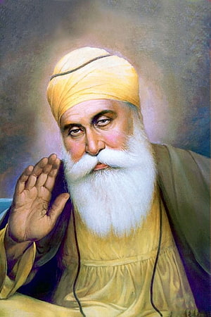 Guru Nanak Dev Ji Portrait in Traditional Yellow Turban and Robe HD phone wallpaper