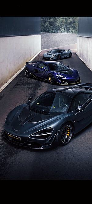 McLaren 720S, 765LT, and 600LT Supercars Lined Up in a Concrete Tunnel HD phone wallpaper