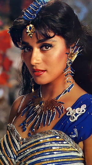 Madhuri Dixit in ornate blue and gold costume with elaborate jewelry and headpiece HD phone wallpaper