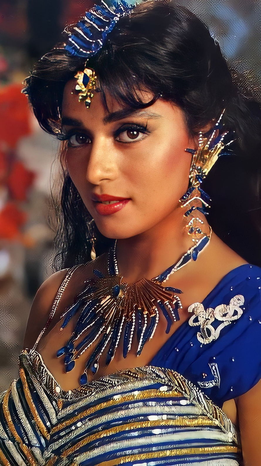 Madhuri Dixit in ornate blue and gold costume with elaborate jewelry and headpiece HD phone wallpaper