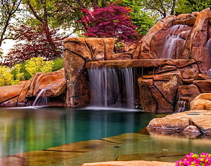 Serene Garden Waterfall With Red Maple Trees And Calm Pool HD wallpaper