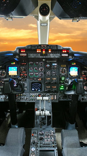 Commercial Airplane Cockpit Interior with Sunset Sky View Through Windshield HD phone wallpaper