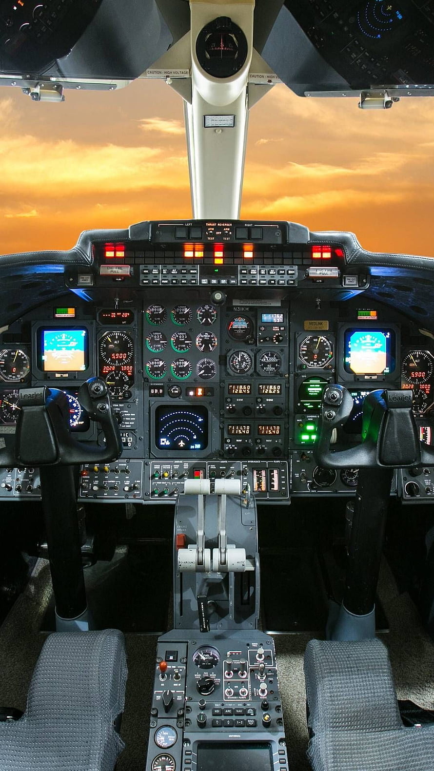 Commercial Airplane Cockpit Interior with Sunset Sky View Through Windshield HD phone wallpaper