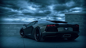 Black Lamborghini Aventador Rear View Under Dramatic Stormy Sky HD wallpaper