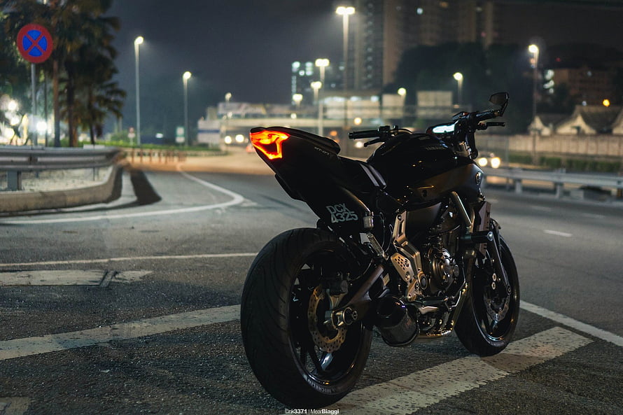Black Yamaha MT-07 Motorcycle Parked on City Street at Night HD wallpaper
