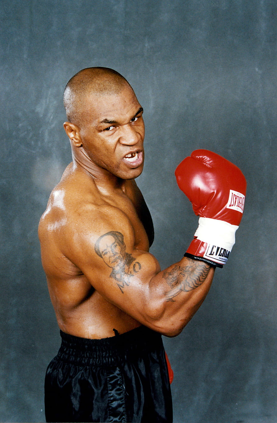 Mike Tyson in a Fierce Boxing Stance Wearing Red Everlast Gloves HD phone wallpaper