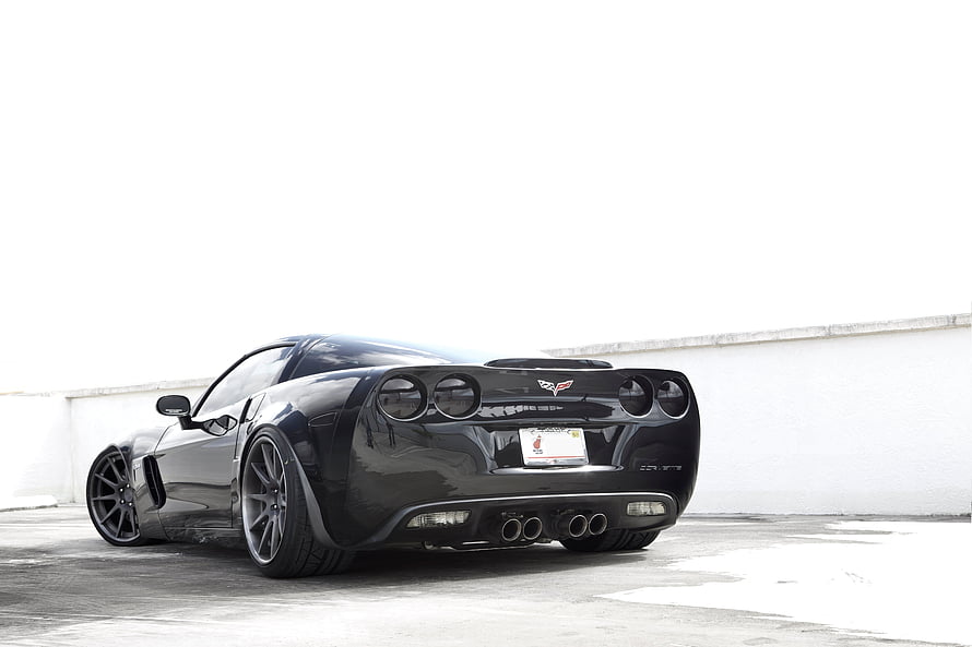 Rear Three-Quarter View of a Black Chevrolet Corvette Z06 Supercharged Sports Car HD wallpaper