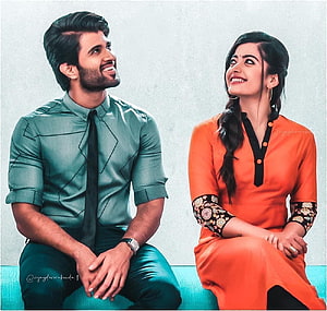 Vijay Devarakonda and Rashmika Mandanna smiling together in stylish casual outfits HD wallpaper