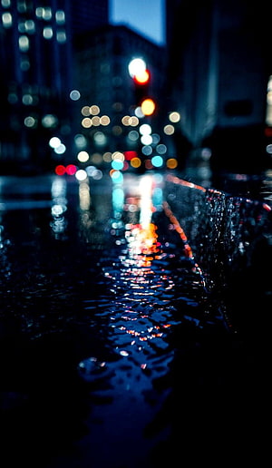 Moody Night Cityscape with Bokeh Lights Reflecting on Wet Asphalt HD phone wallpaper