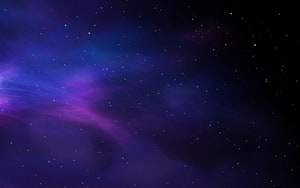Vibrant Purple and Blue Nebula Clouds Scattered Across a Deep Starry Night Sky HD wallpaper