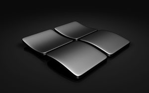 Sleek Black Microsoft Windows 3D Logo on Dark Reflective Surface HD wallpaper