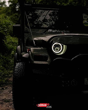 Mahindra Thar Off-Road SUV Front Headlight Close-Up in Dark Forest Setting HD phone wallpaper
