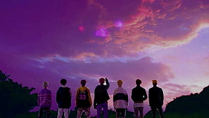 BTS Members Silhouetted Against a Vibrant Purple Sunset Sky HD wallpaper