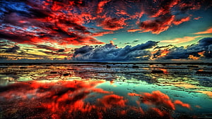 Vivid Red Fire Clouds Reflected in Shallow Water at Dramatic Sunset HD wallpaper